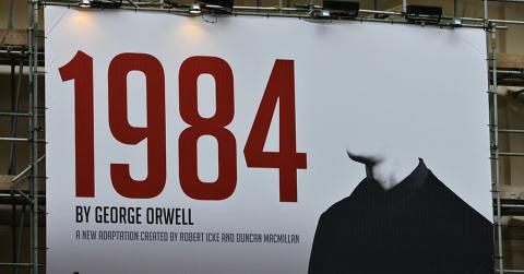View a billboard advertising Robert Icek and Ducan MacMillan's theatrical adaptation of George Orwell's Nineteen Eighty-Four