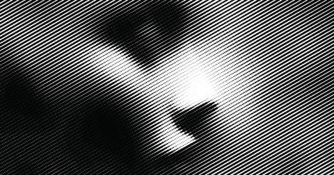 Abstrakte Silhouette eines Gesichts im Halbraster, hell-dunkel kontrastiert